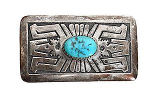 A Silver and Single Cabochon Turquoise Stone Belt Buckle, Tommy Singer Height 2 x width 3 1/2 inches.