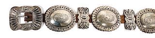 A Navajo Silver Concho Belt Buckle height 2 7/8 x width 3 5/8 inches.