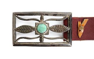 A Navajo Silver Sand Cast and Turquoise Belt Buckle Height 2 1/4 x width 4 inches.