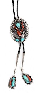 A Navajo Silver, Turquoise and Coral Bolo Height 3 x 2 1/4 inches.