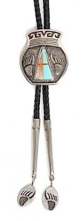 A Navajo Silver and Multiple Stone Inlay Bolo, Abraham Begay Height 2 1/4 x width 2 inches.