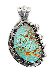 A Contemporary Navajo Silver and Turquoise Pendant, Jimmy Secatero Height 3 inches.
