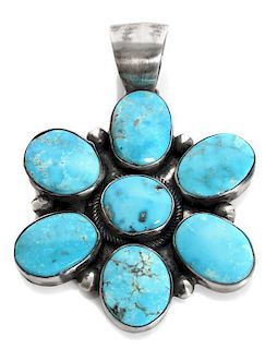 A Navajo Silver and Turquoise Flower Pendant Height 3 inches.