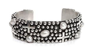 A Navajo Silver and Pearl Bracelet, Ronnie Willie Length 5 3/8 x opening 1 1/8 x width 3/4 inches.