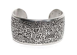 A Navajo Silver Cuff Bracelet, Norbert Peshlakai Length 5 5/8 x opening 1 x width 1 1/4 inches.