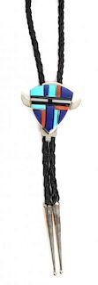 A Navajo Silver and Multiple Stone Inlay Bolo, Annabelle Peterson Height 1 3/4 x width 7/8 inches.