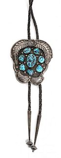 A Navajo Silver and Turquoise Bolo Height 3 1/2 x width 3 inches.