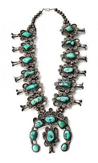 A Large Southwestern Silver and Turquoise Squash Blossom Necklace Length 22 1/2 ; naja length 4 x width 3 1/4 inches (approx.)