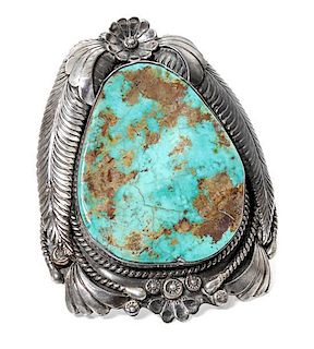 A Large Southwestern Silver and Turquoise Bracelet Length 5 1/2 x opening 1 1/4 x width 3 1/2 inches.