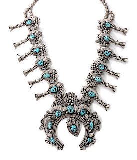 A Large Southwestern Silver and Turquoise Squash Blossom Necklace Length 28 inches; naja 5 x 5 inches.