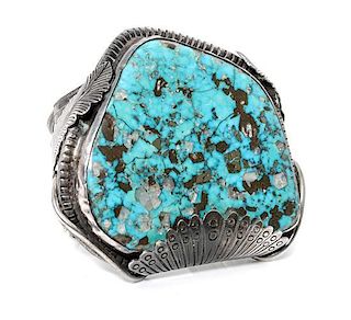 A Monumental Southwestern Silver and Turquoise Bracelet Length 5 3/4 x opening 1 1/2 x width 3 inches.
