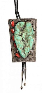 A Monumental Southwestern Silver, Turquoise and Coral Bolo Height 6 x width 4 inches.