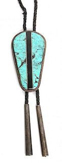 A Southwestern Silver, Turquoise and Jet Bolo Height 3 1/4 x width 1 3/4 inches.