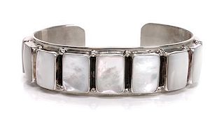 A Southwestern Silver and Mother of Pearl Cuff Bracelet Length 5 7/8 x opening 1 x width 3/4 inches.