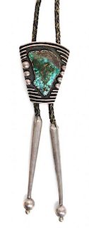 A Southwestern Silver and Turquoise Bolo Height 2 x 1/2 inches.