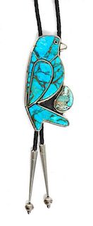 A Southwestern Silver and Turquoise Bolo Height 3 1/2 x width 1 3/4 inches.