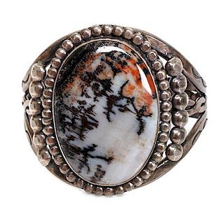 A Southwestern Silver and Agate Bracelet Length 5 x opening 1 x width 2 inches.