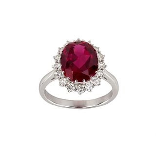 White gold ring with synthetic ruby and diamonds.