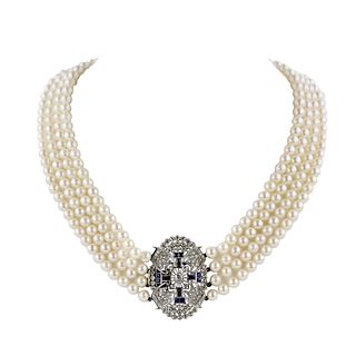 Pearl necklace with medallion in platinum and gold  with sapphires and diamonds.