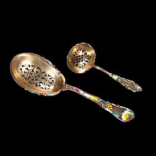 Set of enameled sterling serving spoons.