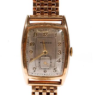 Vintage Movado 14k gold watch with associated bracelet.