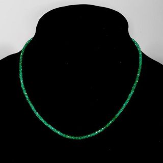 Emerald and 18k gold necklace.