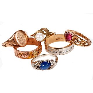 Group of gold and gem-set rings.