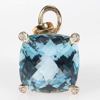 Blue topaz, diamond and 14k gold pendant.
