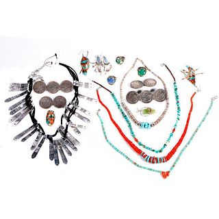 Collection of silver and metal jewelry.