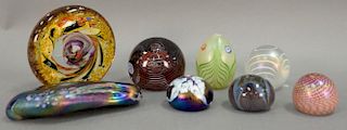 Eight art glass paper weights, three signed indistinctly.