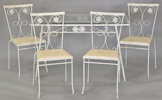 Wrought iron glass top table and four chairs. top: 48 1/4" x 28"