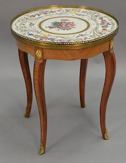 Small stand with French porcelain inset top. ht. 21in., dia. 18in.