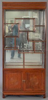 Chinese curio cabinet with eight glass shelves. ht. 79 3/4in., wd. 36in.