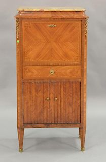 Louis XVI style marble top cabinet with two drop down doors, each with magazine racks and one drawer. ht. 50in., wd. 25in., dp. 14in.