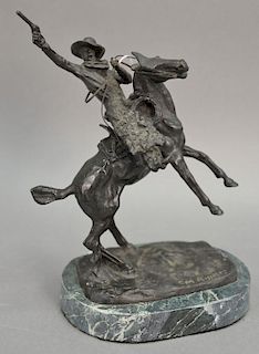 C.M. Russell bronze sculpture of a cowboy on a granite base. ht.11 1/2in.