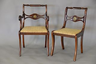 Duncan Phyfe mahogany table with three leaves and six chairs each with brass plaque. ht. 29 1/2in.; top: 66" x 44"