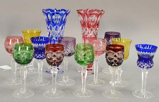 Group of twelve Bohemian cut to clear multicolor stemmed cordials (ht. 5in.) and pair of vases (ht. 7 1/2in.).