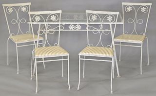 Wrought iron glass top table and four chairs. ht. 29in., top: 28" x 48"