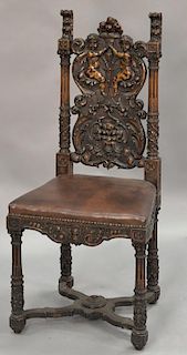 Continental style carved walnut side chair with cherubs.