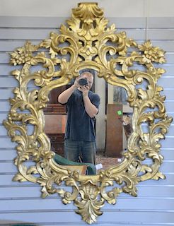 Gilt decorated pierced carved wood mirror. 55" x 42"