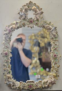 Mirror with French porcelain framed figures and flowers. 29" x 20"