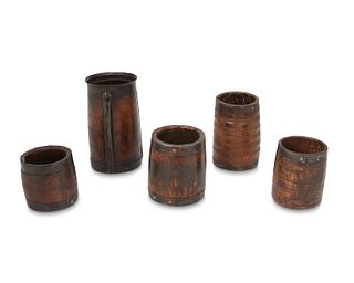 A collection of treen wood and metal barrels