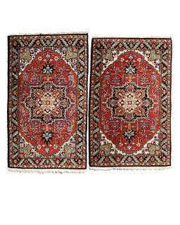 A pair of Heriz area rugs