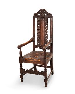 A Continental carved wood armchair
