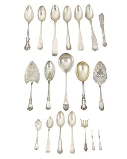 A group of silver-plated flatware