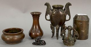 Group of Chinese bronze pieces to include multimetal bronze seal, bronze vase, two bronze censors, and a small bronze foo dog. ht. 1...