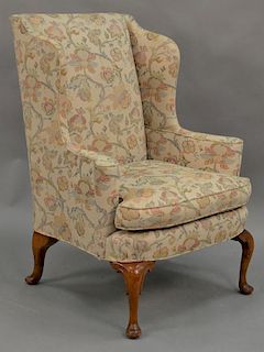 Queen Anne style upholstered wing chair.