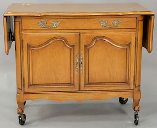 Two piece lot including a one drawer over two door serving cart and a French Provencial marble top server. ht. 27 1/2in., top: 18" x...