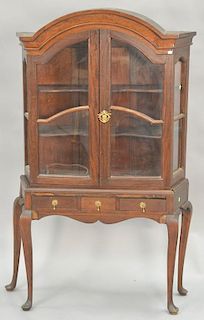 Mahogany curio cabinet in two parts. ht. 62in., wd. 38in., dp. 12in.