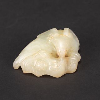 A CHINESE CARVED JADE RAM 